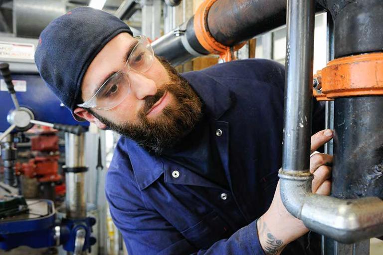 Plumber in workshop