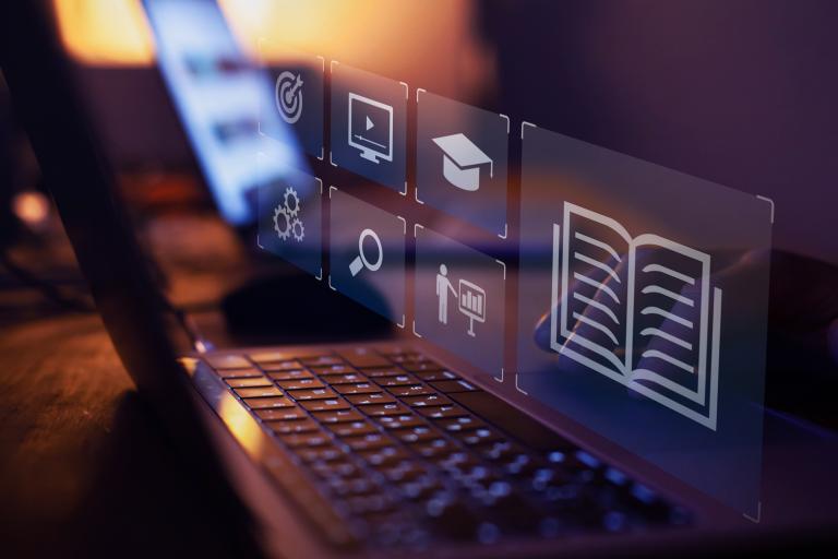 Image of laptop with virtual icons appearing over keyboard