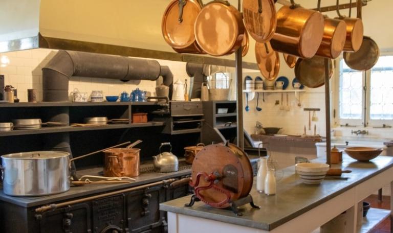 Large cooking kitchen with ovens, saucepans and utensils