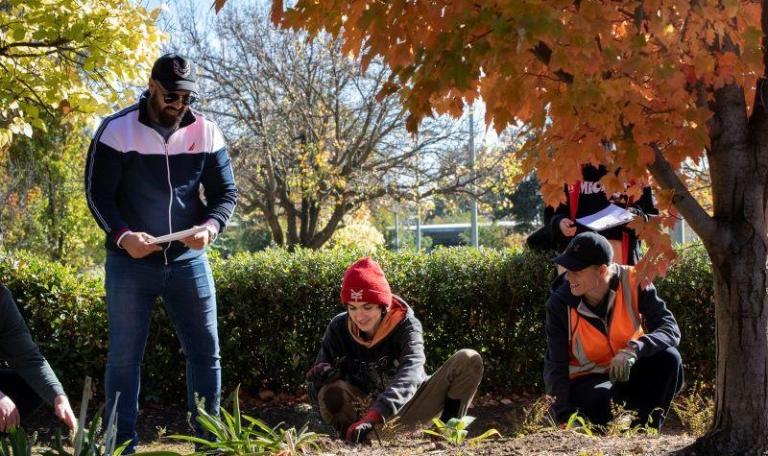 Horticulture students having class outside and taking environment samples