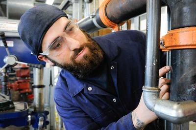 Plumber in workshop