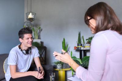 Teenage boy speaking to support worker